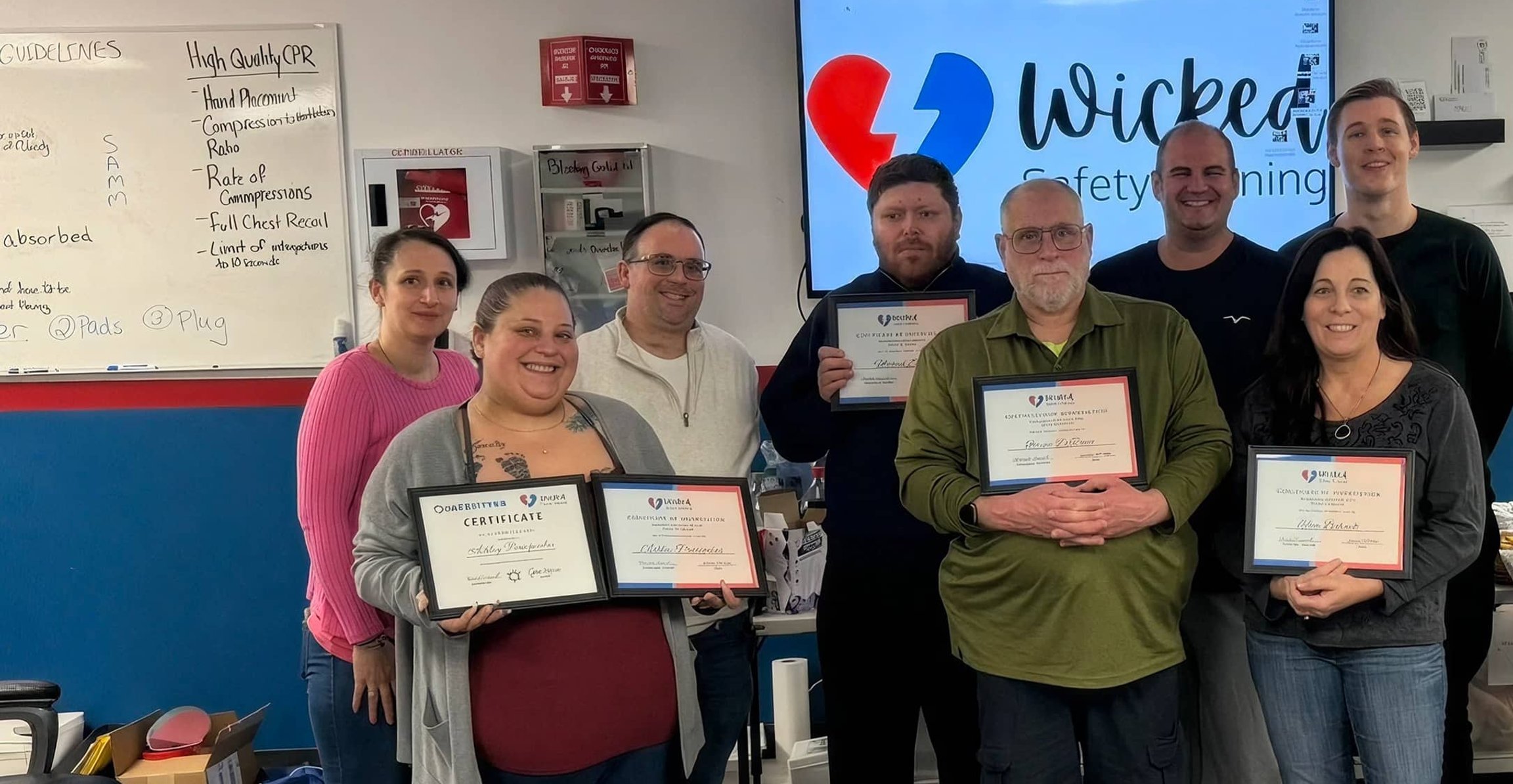 Students holding Wicked Safety Training certificates
